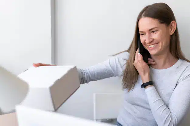 Medium shot woman holding phone 23