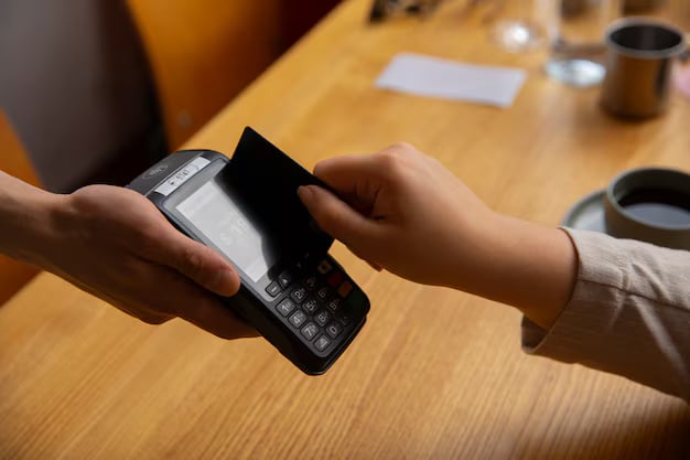 Side view customer paying with nfc device 23