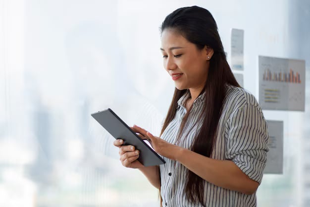 Side view smiley woman holding tablet 23
