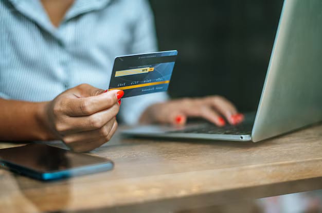 Woman paying online with credit card