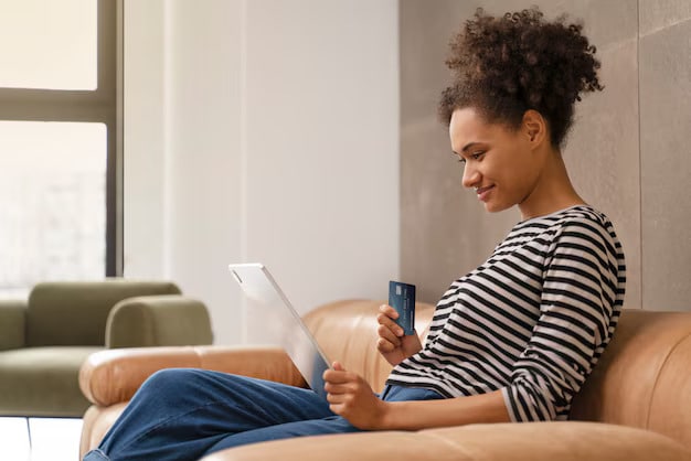 Young woman doing her shopping online 23